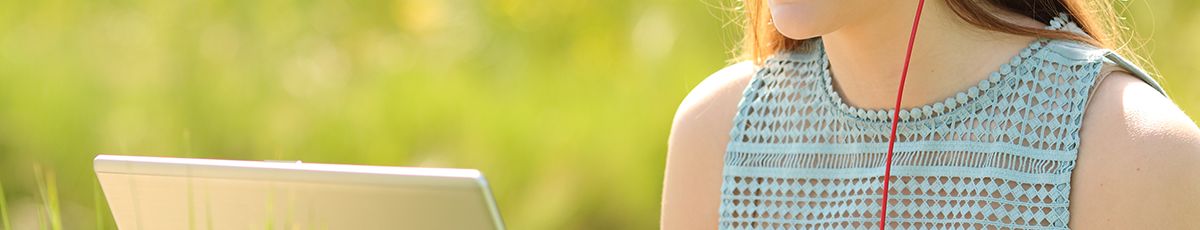 Girl on laptop outside summer S