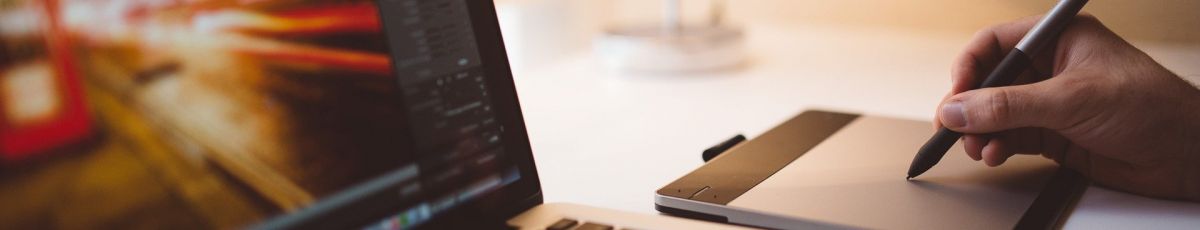 A student taking an online course in front of a computer screen