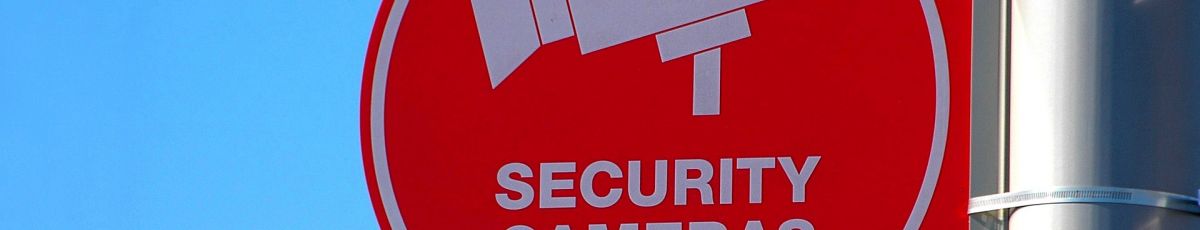 a cctv sign mounted to a wall