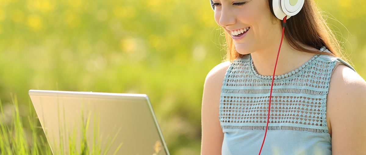 Girl on laptop outside summer S
