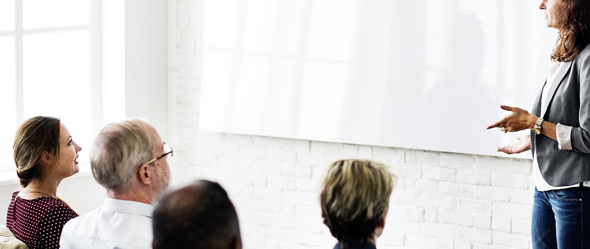 professional presenting in meeting woman s