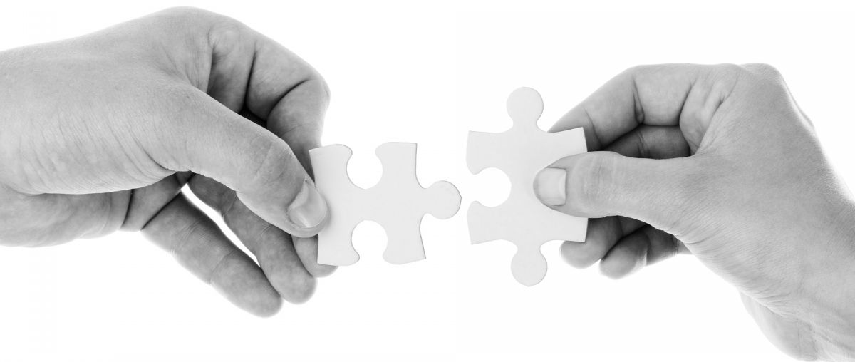two jigsaw parts nearly connected