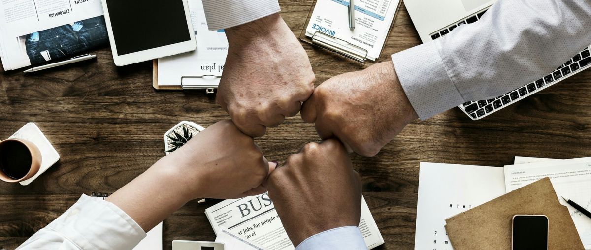 a group fistbumping