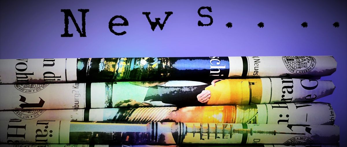 a stack of newspapers with the text 'news'