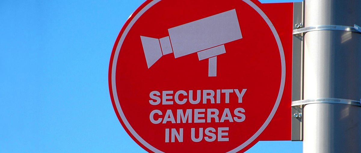 a cctv sign mounted to a wall