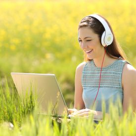 Girl on laptop outside summer S
