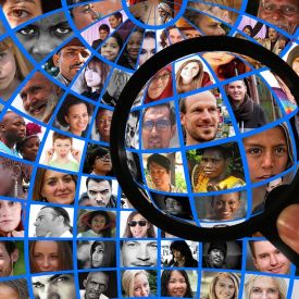 a magnifying lens looking at different people