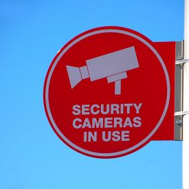 a cctv sign mounted to a wall