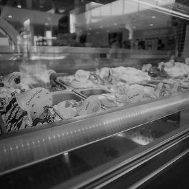 A gray image of different flavors of ice cream implying each student has their own flavor