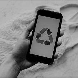 A gray image of a cellphone showing a recycle symbol implying to reuse class content